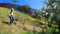 When Dan Bell drives through his ,-acre cattle ranch, he speaks of the hurdles that the Border Patrol faces in his rolling green hills of oak and mesquite trees -- the hours it takes to drive to some places, the wilderness areas that are generally off-limits to motorized vehicles, the environmental reviews required to extend a dirt road.